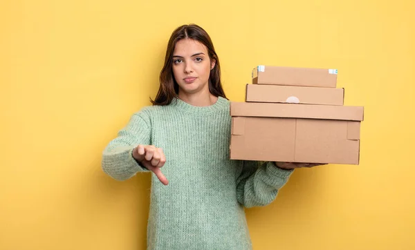 Pretty Woman Feeling Cross Showing Thumbs Packages Boxes Concept — Stock Photo, Image