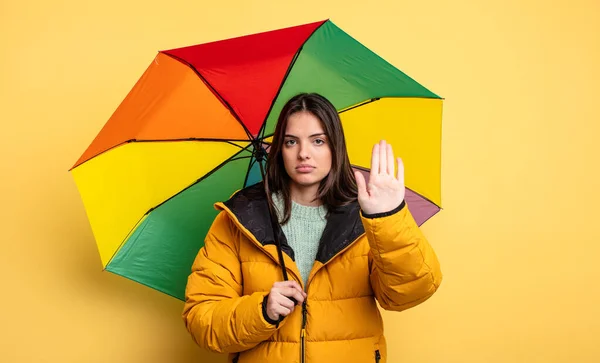 Pretty Woman Looking Serious Showing Open Palm Making Stop Gesture — стоковое фото