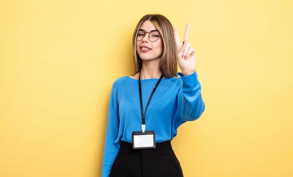 Pretty Woman Smiling Looking Friendly Showing Number Two Accreditation Card — Stock Photo, Image