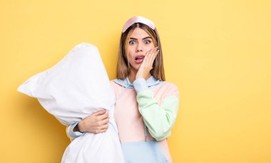 pretty woman feeling shocked and scared. pajamas concept