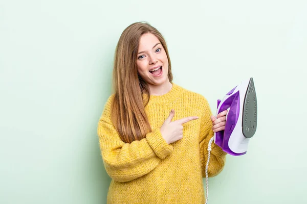 Redhair Woman Looking Excited Surprised Pointing Side Iron Clothes Concept — Stock Photo, Image