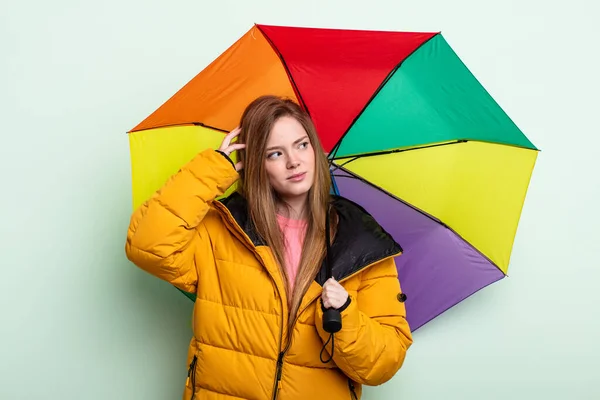 Redhair Woman Feeling Puzzled Confused Scratching Head Umbrella Concept — Stock Photo, Image