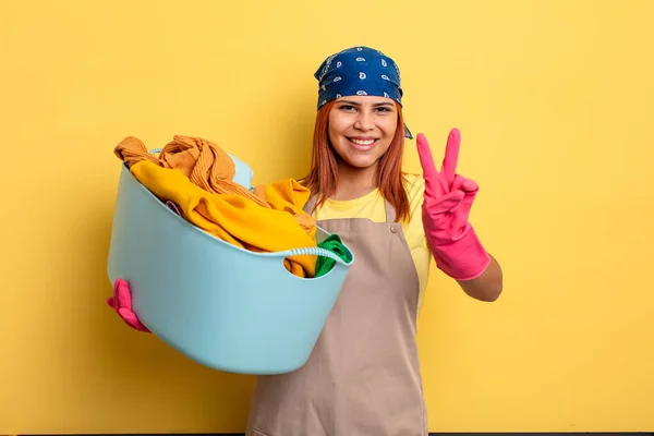 Housekeeper Smiling Looking Happy Gesturing Victory Peace Washing Clothes Concept — Stock Photo, Image