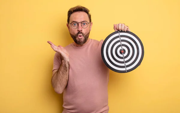 Middle Age Man Looking Surprised Shocked Jaw Dropped Holding Object — Zdjęcie stockowe