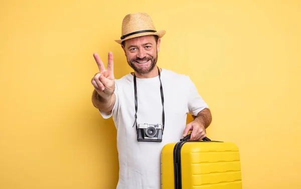 Middle Age Man Tourist Smiling Looking Happy Gesturing Victory Peace — Φωτογραφία Αρχείου