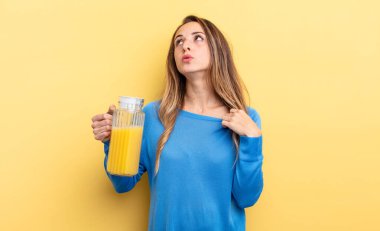 pretty woman feeling stressed, anxious, tired and frustrated orange juice concept