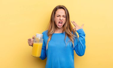 pretty woman looking unhappy and stressed, suicide gesture making gun sign orange juice concept