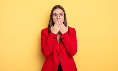 pretty woman covering mouth with hands with a shocked. businesswoman concept