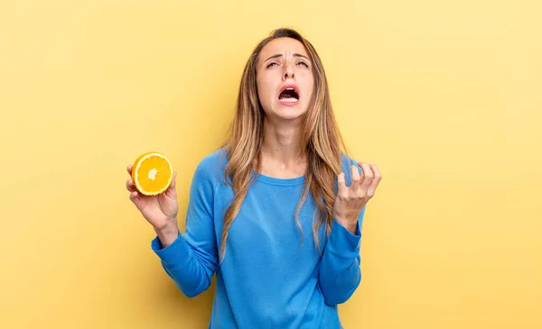 Pretty Woman Looking Desperate Frustrated Stressed Holding Half Orange — Fotografia de Stock