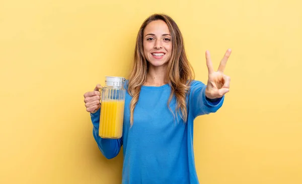 Pretty Woman Smiling Looking Happy Gesturing Victory Peace Orange Juice — Zdjęcie stockowe