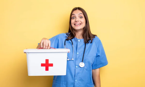 Pretty Woman Looking Happy Pleasantly Surprised Nurse First Aid Kit — Fotografia de Stock