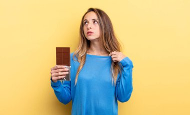 pretty woman feeling stressed, anxious, tired and frustrated. chocolate concept