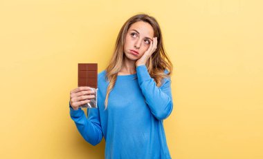 pretty woman feeling bored, frustrated and sleepy after a tiresome. chocolate concept