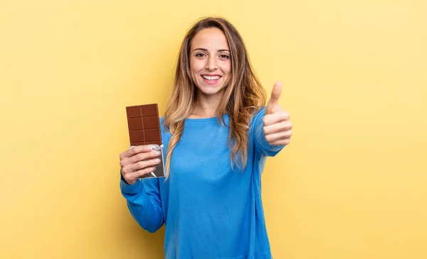Pretty Woman Feeling Proud Smiling Positively Thumbs Chocolate Concept — стоковое фото