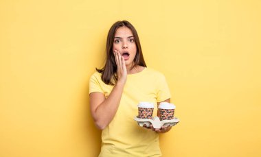 pretty woman feeling shocked and scared. take away coffee concept