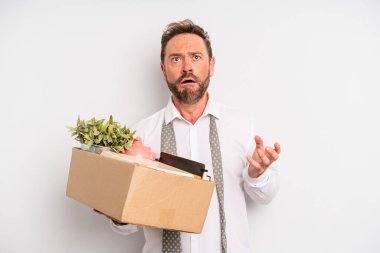 middle age man looking desperate, frustrated and stressed. unemployment concept