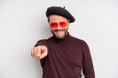 middle age man pointing at camera choosing you. actor artist concept