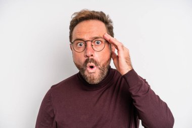 middle age man looking surprised, realizing a new thought, idea or concept