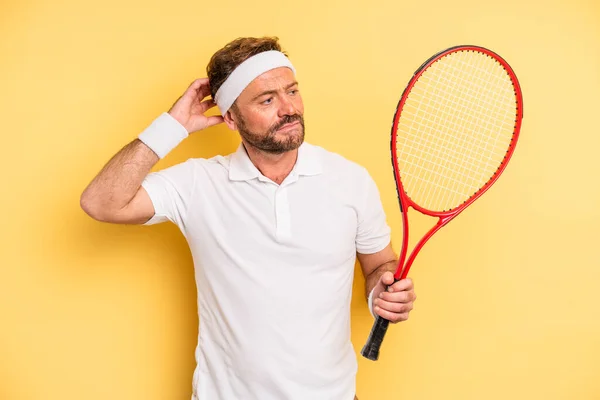 Middle Age Man Feeling Puzzled Confused Scratching Head Tennis Concept — Stockfoto