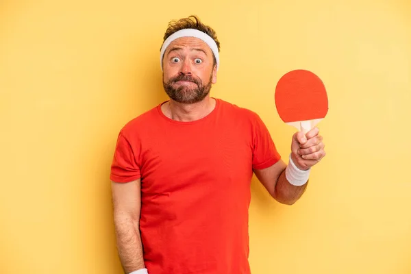 Middle Age Man Shrugging Feeling Confused Uncertain Ping Pong Concept — Stockfoto