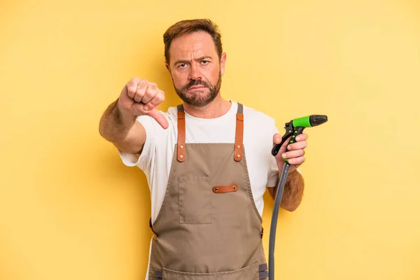 Middle Age Man Feeling Cross Showing Thumbs Gardener Hose Concept — Stock Photo, Image