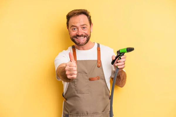 Middle Age Man Feeling Proud Smiling Positively Thumbs Gardener Hose — Stock Photo, Image