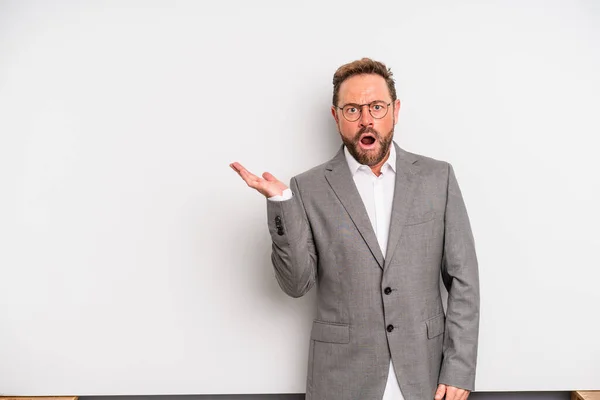 Middle Age Man Looking Surprised Shocked Jaw Dropped Holding Object — Foto Stock