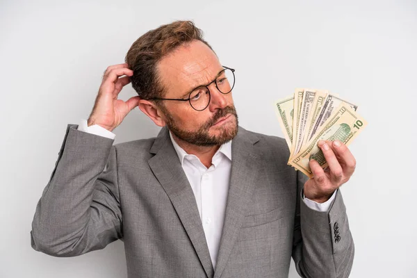 Middle Age Man Feeling Puzzled Confused Scratching Head Dollar Banknotes — Stockfoto