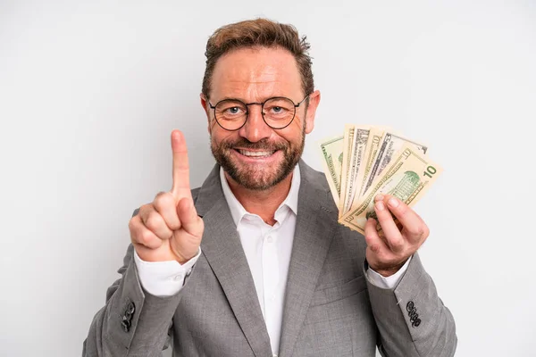 Middle Age Man Smiling Looking Friendly Showing Number One Dollar — Φωτογραφία Αρχείου