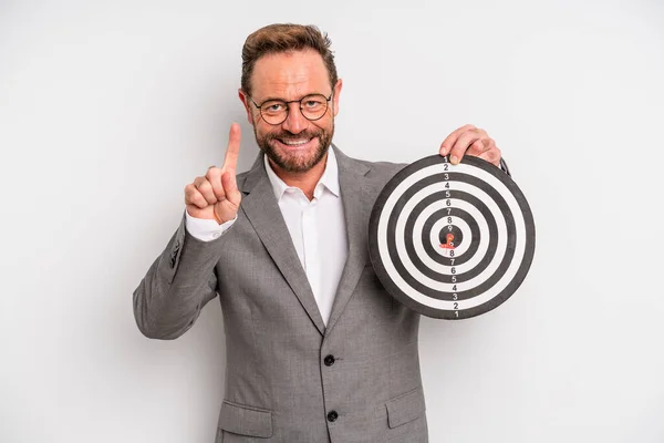 Middle Age Man Smiling Looking Friendly Showing Number One Target — Zdjęcie stockowe