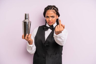 afro black woman feeling angry, annoyed, rebellious and aggressive. waiter with a cocktail