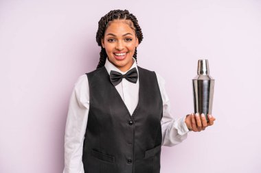 afro black woman looking happy and pleasantly surprised. waiter with a cocktail
