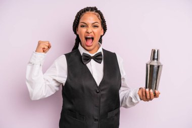 afro black woman shouting aggressively with an angry expression. waiter with a cocktail