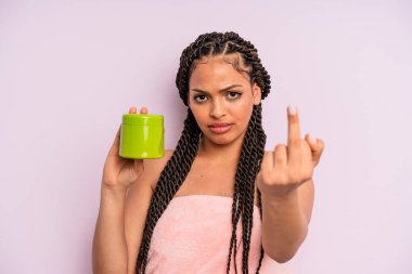 afro black woman feeling angry, annoyed, rebellious and aggressive. hair treatment concept