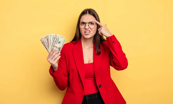 Pretty Woman Feeling Confused Puzzled Showing You Insane Dollar Banknotes — Stockfoto