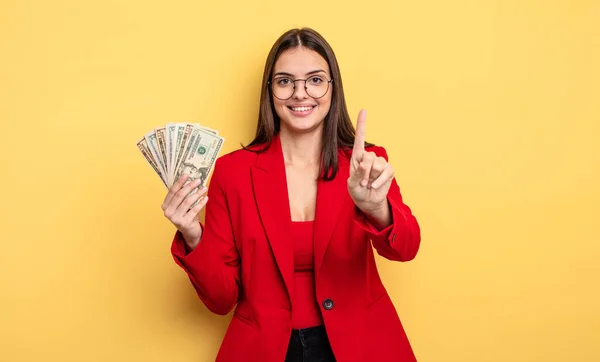 Pretty Woman Smiling Looking Friendly Showing Number One Dollar Banknotes —  Fotos de Stock