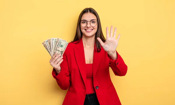 Pretty Woman Smiling Looking Friendly Showing Number Five Dollar Banknotes — Stockfoto