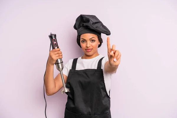 Afro Black Woman Smiling Looking Friendly Showing Number One Chef — Foto Stock