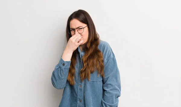 Pretty Caucasian Woman Feeling Disgusted Holding Nose Avoid Smelling Foul — Stok fotoğraf