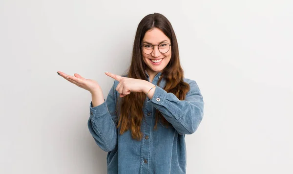 Pretty Caucasian Woman Smiling Cheerfully Pointing Copy Space Palm Side — Stockfoto