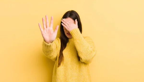 Pretty Caucasian Woman Covering Face Hand Putting Other Hand Front — Zdjęcie stockowe