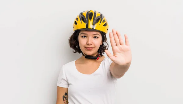 Pretty Hispanic Girl Looking Serious Showing Open Palm Making Stop — Stock Photo, Image