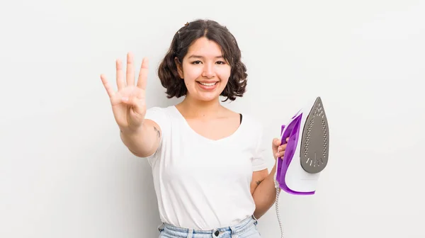 Pretty Hispanic Girl Smiling Looking Friendly Showing Number Four Laundry — Stock Photo, Image