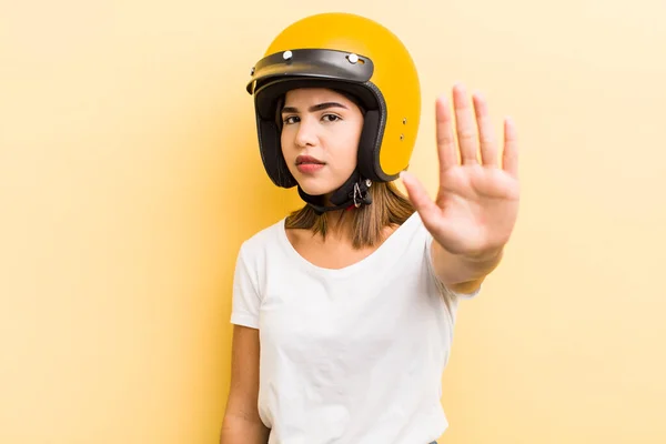 Pretty Hispanic Girl Looking Serious Showing Open Palm Making Stop — Stock Photo, Image