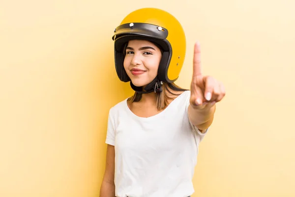 Pretty Hispanic Girl Smiling Looking Friendly Showing Number One Motorbike — Stock Photo, Image