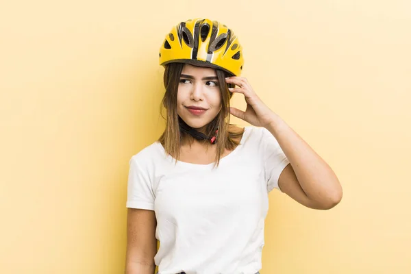Pretty Hispanic Girl Feeling Puzzled Confused Scratching Head Bike Concept — Stock Photo, Image