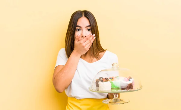 Pretty Hispanic Girl Covering Mouth Hands Shocked Home Made Cakes — Stock Photo, Image