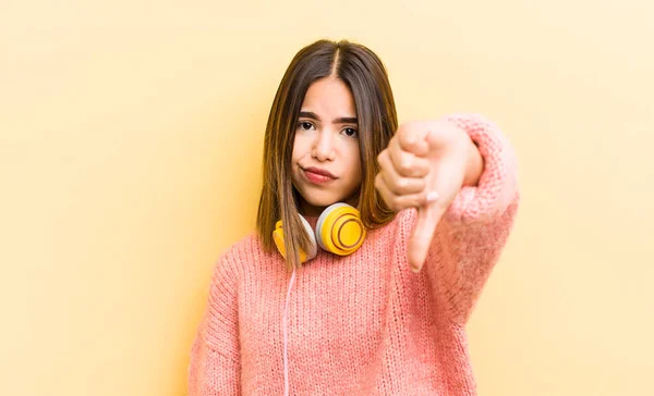 Pretty Hispanic Girl Feeling Cross Showing Thumbs Headphones Concept — Stock Photo, Image