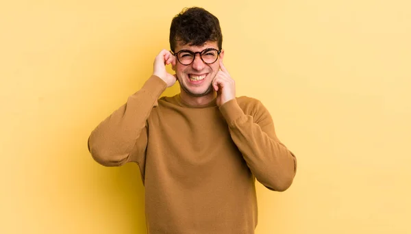Young Handsome Man Looking Angry Stressed Annoyed Covering Both Ears — Stock Photo, Image