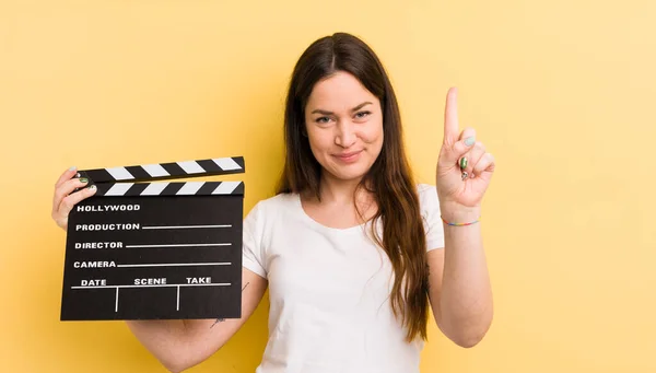 Young Pretty Woman Smiling Looking Friendly Showing Number One Cinema — Stock Photo, Image